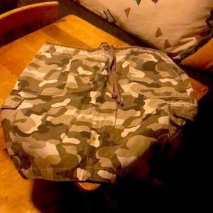 Camouflage skirt with cargo pockets.